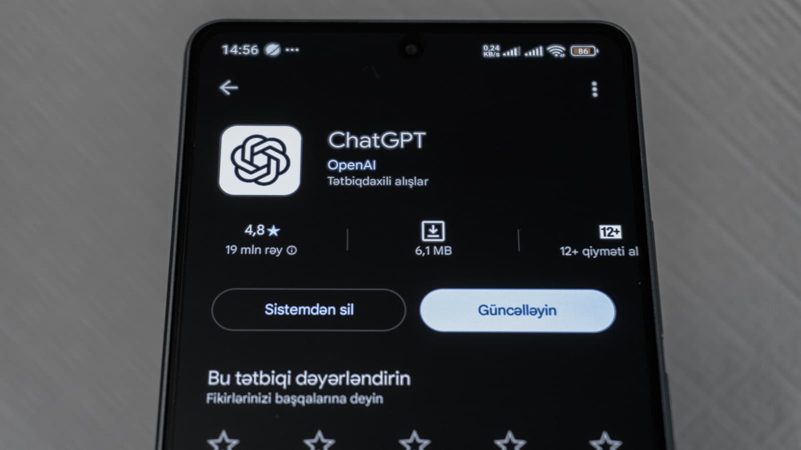 Smartphone screen showing ChatGPT app details, representing OpenAI's rumored AI phone